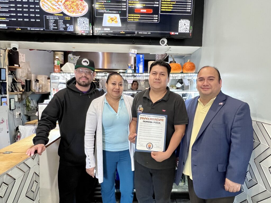 Vice Chairman of the Bronx Conservative Party, Gonzalo Duran giving Famosa Pizza a Proclamation