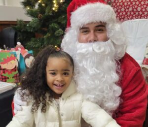 Gonzalo Duran as Santa Claus with Little Girl