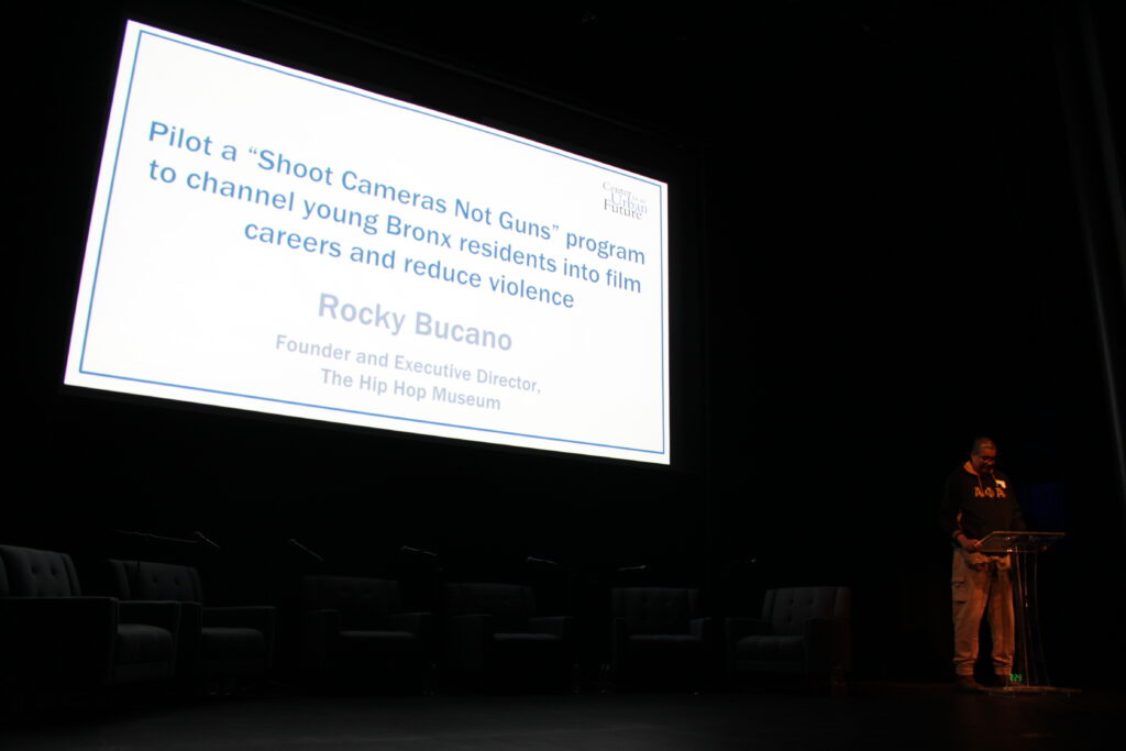 Photo by Gonzalo Duran of Rocky Bucano Speaking at the Podium at the Ideas for Creating a Stronger and More Equitable Bronx.