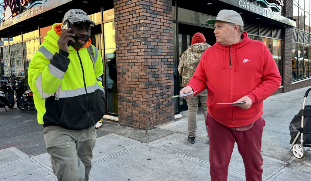 Gary Lutz giving out political pamphlets