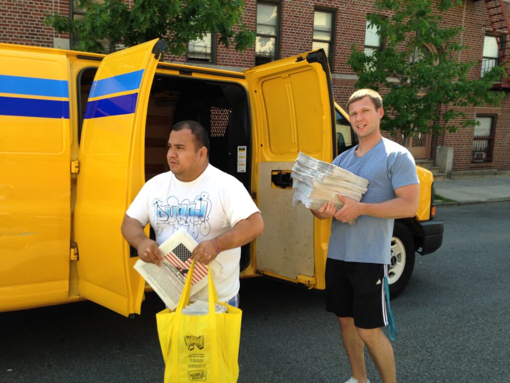Gonzalo Duran and Yegor Zubarev Dropping off Newsletters